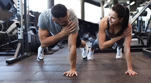 Toning Bingo Wings: Your Ultimate Guide to Sculpting Sleek Arms at the Gym 3 Fitness trainer demonstrating arm toning exercises Walsall