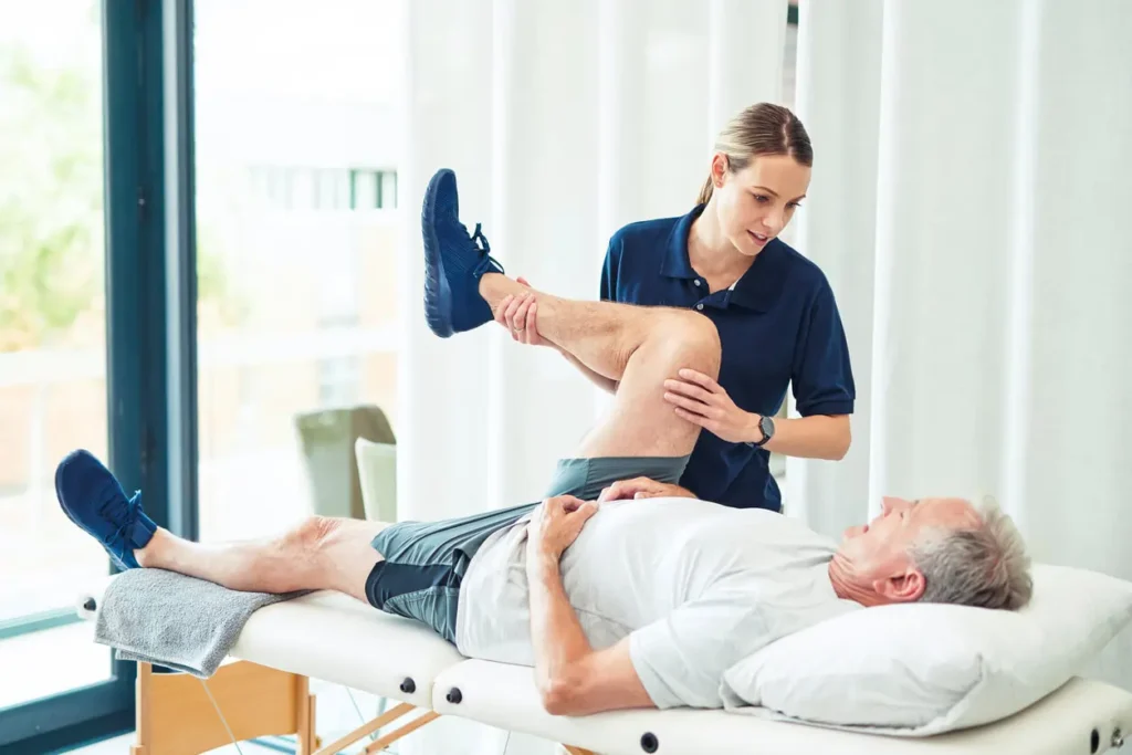 Revitalising Recovery: Effective Rehabilitation Strategies for Muscle Injuries 3 Physiotherapist assisting a patient with muscle recovery exercises Walsall